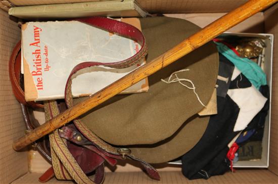 A collection of military cloth badges, officers cap, Sam Browne, a gold braid dress belt etc.